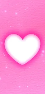 Vibrant pink wallpaper with a glowing white heart design.