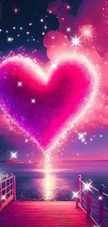 Vibrant pink heart with fireworks over water at night.