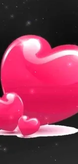 Glossy pink hearts on black background wallpaper.