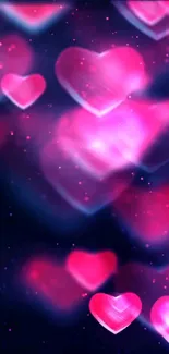 Glowing pink hearts on dark background wallpaper.