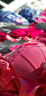 A vibrant display of pink bras arranged elegantly.