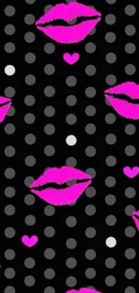 Mobile wallpaper with pink lips and polka dots on black background.