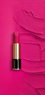 Vibrant pink lipstick on textured background.