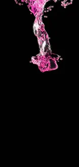 Vibrant pink liquid splash on a black background.