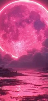 Vibrant pink full moon in a scenic landscape.