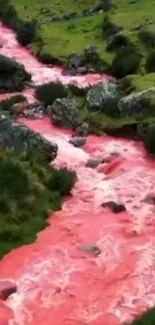 A vibrant pink river flows through lush greenery.