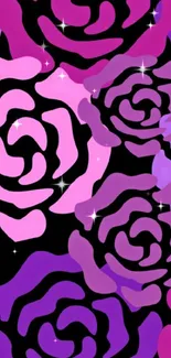 Vibrant hot pink roses on black background wallpaper.