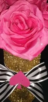 Elegant pink roses in a glittery gold jar with bow.