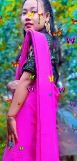 A striking pink saree against a lush blue and yellow nature backdrop.