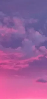 Vibrant pink sky with clouds during sunset, perfect for mobile wallpaper.