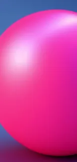 Vibrant pink sphere on a blue gradient background.