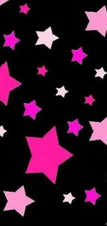 Vibrant wallpaper with pink stars on a black background.