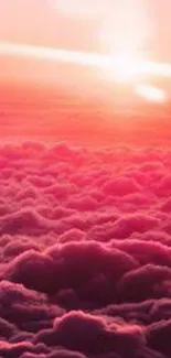 Vibrant pink sunset over cloud formations.