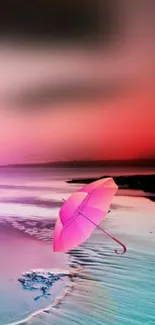 Pink umbrella on a vibrant beach sunset wallpaper.