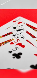 Playing cards on a red background with a bold artistic style.