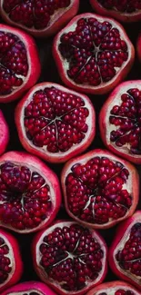 Vibrant pomegranate halves create a stunning mobile wallpaper background.