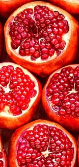 A vibrant mobile wallpaper featuring juicy pomegranate halves in crimson red.