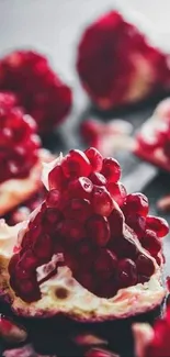 Close-up of vibrant red pomegranate seeds scattered artistically.