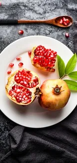 Vibrant pomegranate with seeds on plate, perfect mobile wallpaper.