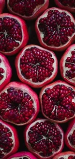 Close-up view of pomegranate halves creating a vibrant and rich red background.