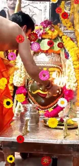 Hindu pooja ritual with vibrant decorations and marigold flowers.