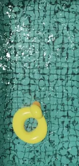 Yellow pool float in a blue-tiled pool, creating a vibrant summer vibe.