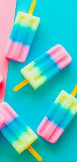 Colorful popsicle wallpaper with pink, blue, and yellow hues on a mobile screen.