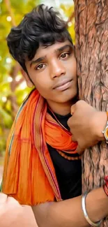 Vibrant portrait of young person hugging a tree in lush greenery.