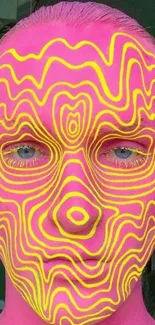 Psychedelic face art with neon pink and yellow patterns.