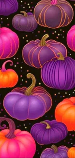 Colorful pumpkin pattern wallpaper with orange and purple hues on a black background.