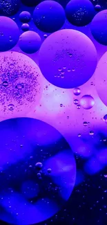 Vibrant purple bubbles forming an artistic abstract phone wallpaper.