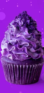 Vibrant purple cupcake with intricate frosting design.