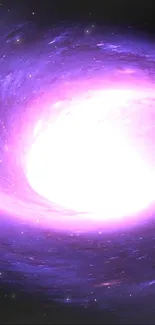 Bright purple spiral galaxy against dark space background.