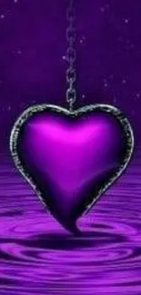 Purple heart pendant over rippling water.