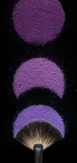 Purple makeup powder with a cosmetic brush on a black background.