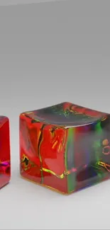 Vibrant 3D cubes with rainbow reflections on a gray background.