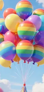 Colorful rainbow balloons against a blue sky.