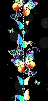 Vibrant rainbow butterfly wallpaper on black background.