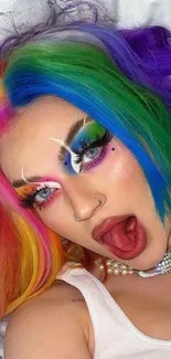 Mobile wallpaper of a person with rainbow-colored hair and bold makeup.