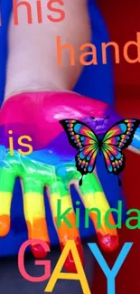 Colorful rainbow painted hand with butterfly.