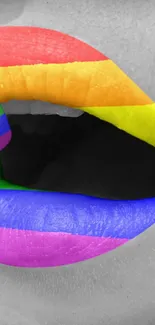 Vibrant rainbow-colored lips on a monochrome background.