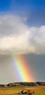 Colorful rainbow over a serene countryside landscape.