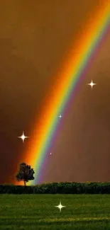 Vibrant rainbow arcs above a lush green field under a dark orange sky.