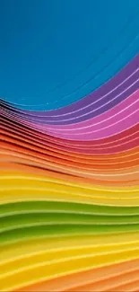 Vibrant layers of colorful paper creating a rainbow effect.