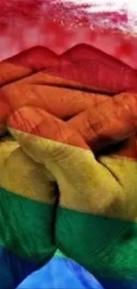 Hands united with a rainbow overlay, symbolizing diversity.