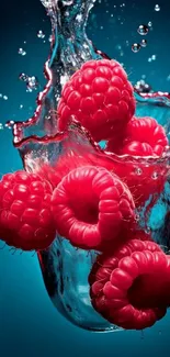 Vibrant red raspberries splashing into clear water, set on a cyan blue background.