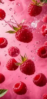 Juicy raspberries splashing with vibrant pink background.