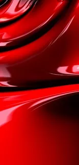 Vibrant red abstract wallpaper with glossy curves.