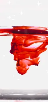 Vibrant red ink swirling in water with sparkles on a white background.