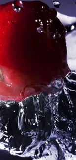 Red apple splashing through water in vibrant wallpaper.